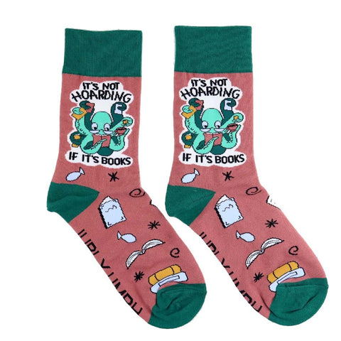 A pair of socks standing against a white background. The socks are green and light brown with a light green octopus. The socks read It's Not Hoarding If It's Books.